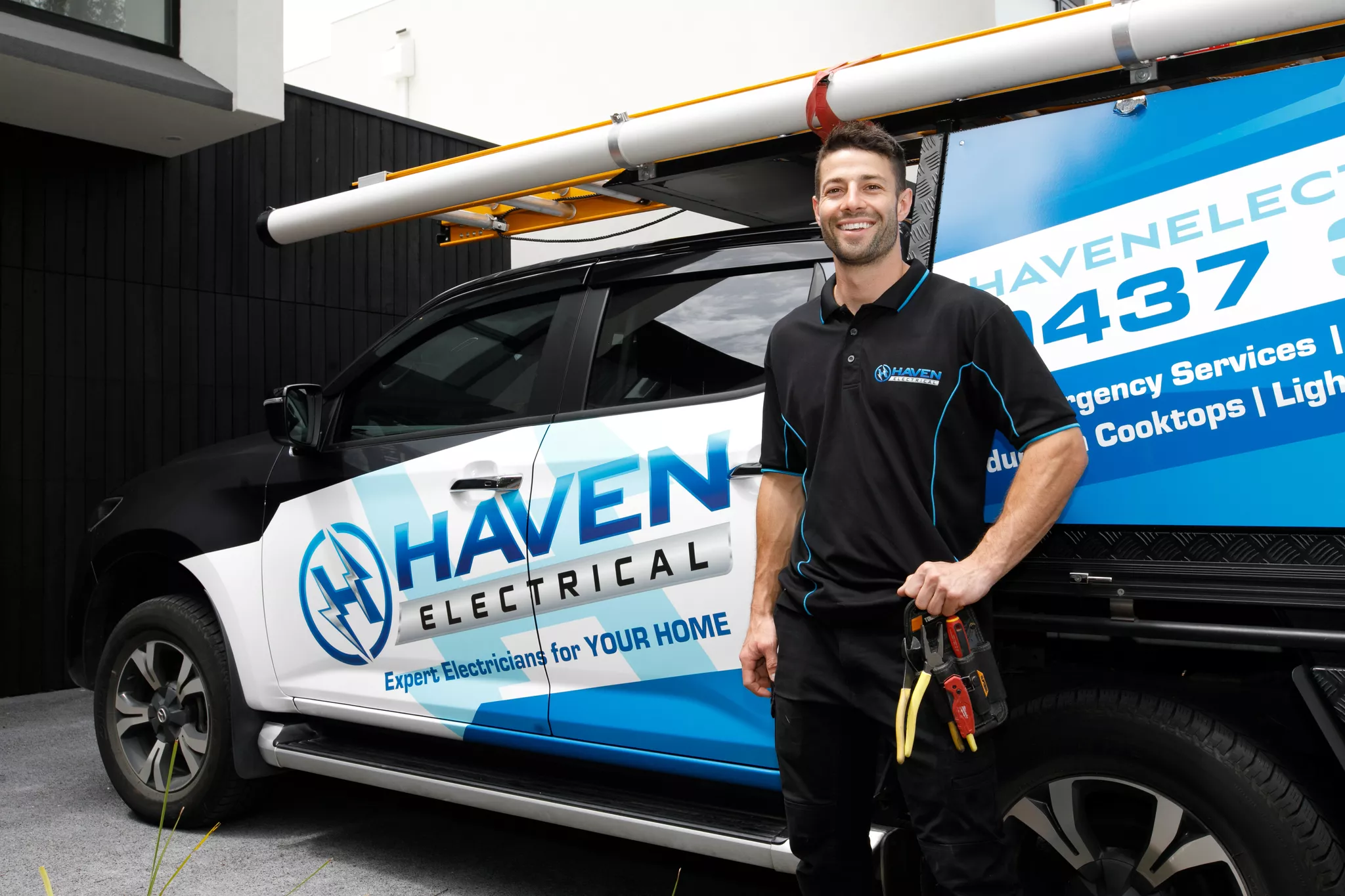 David from Haven Electrical standing next to the company van