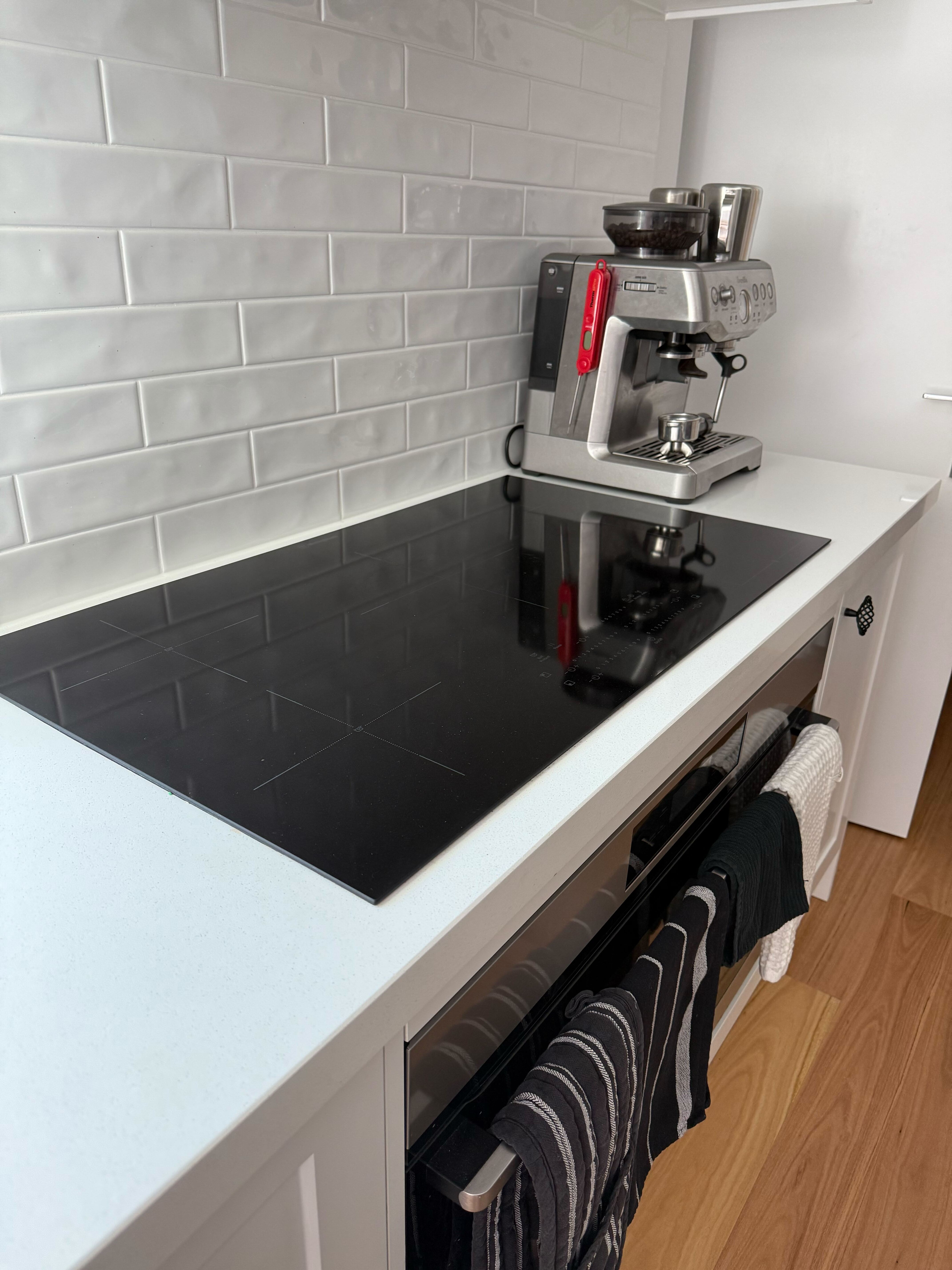 Induction cooktop installation in modern kitchen